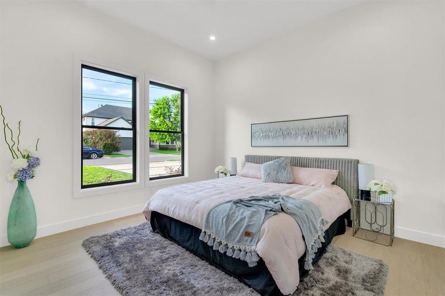 Bedroom featuring light wood-type flooring and recessed lighting