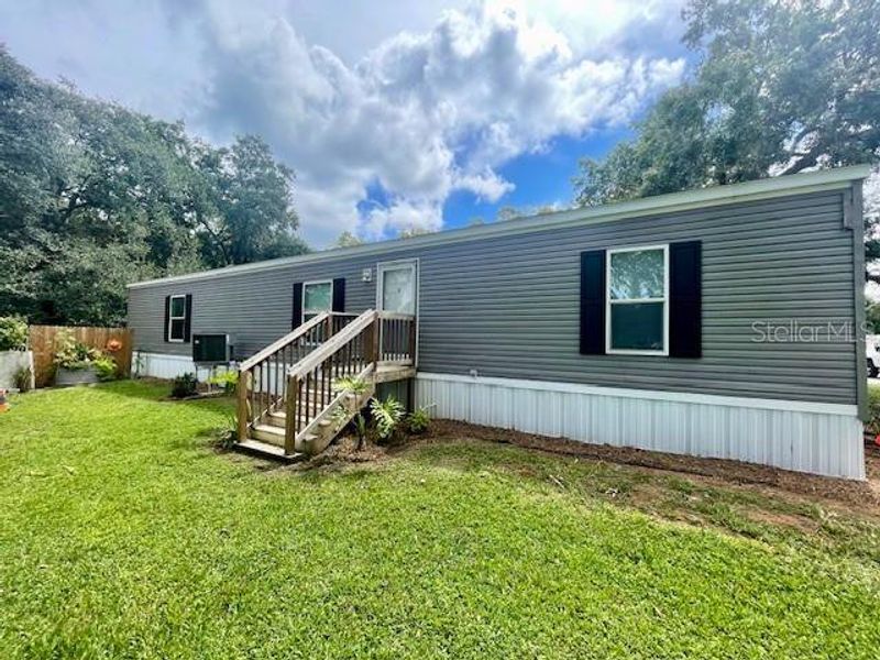 Front exterior of a new home in , Lake Wales, FL, highlighting curb appeal (Image 14).