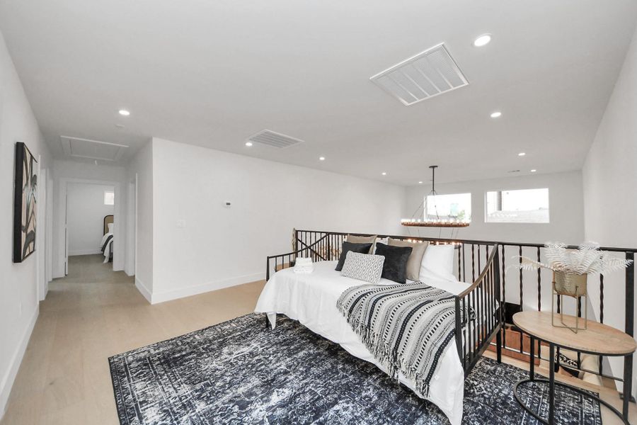 Natural light streams in through the living room windows, creating a bright and inviting atmosphere. Natural light streams in through the living room windows, creating a bright and inviting atmosphere.