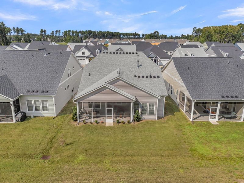 Exterior details and patio area of a home in Summerwind Crossing at Lakes of Cane Bay, Summerville (Image 24).