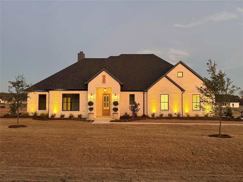 Front exterior of a new home in , Azle, TX, highlighting curb appeal (Image 1).