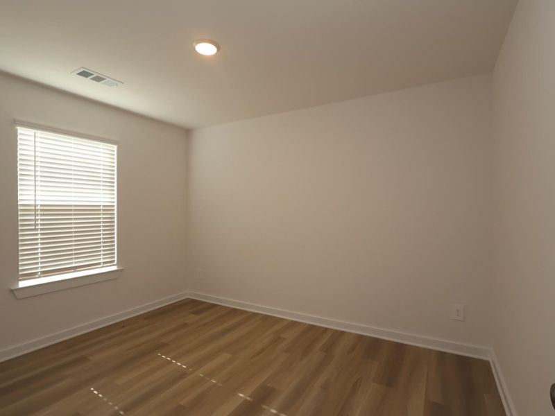 Spacious, unfurnished interior of a new home in Pinewood at Grand Texas, New Caney (Image 14).
