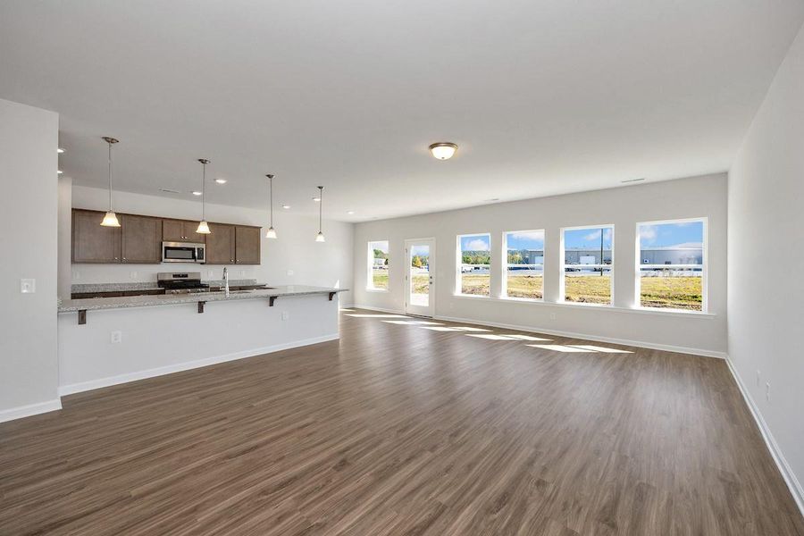 The Avery- Family Room and Breakfast Area. Home under construction. Sample floor plan photo used for illustrative purposes only. Upgrades, selections options, and colors will vary.