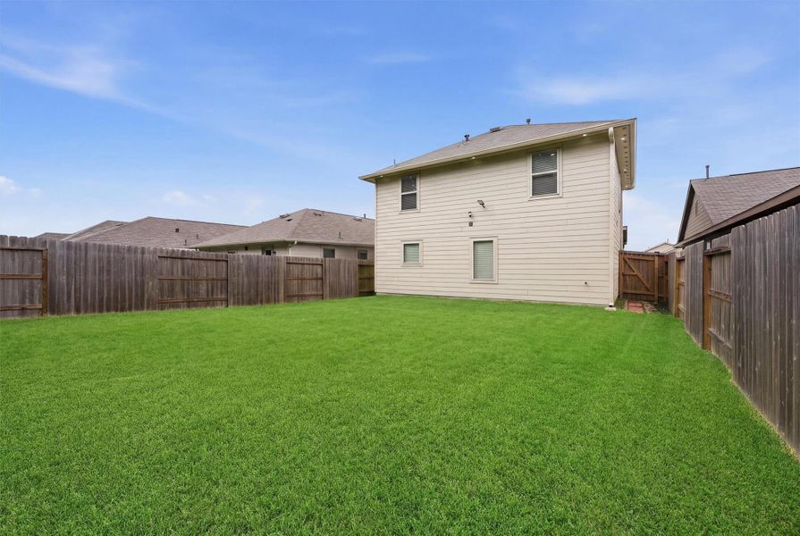 Exterior details and patio area of a home in Pinewood at Grand Texas, New Caney (Image 3).
