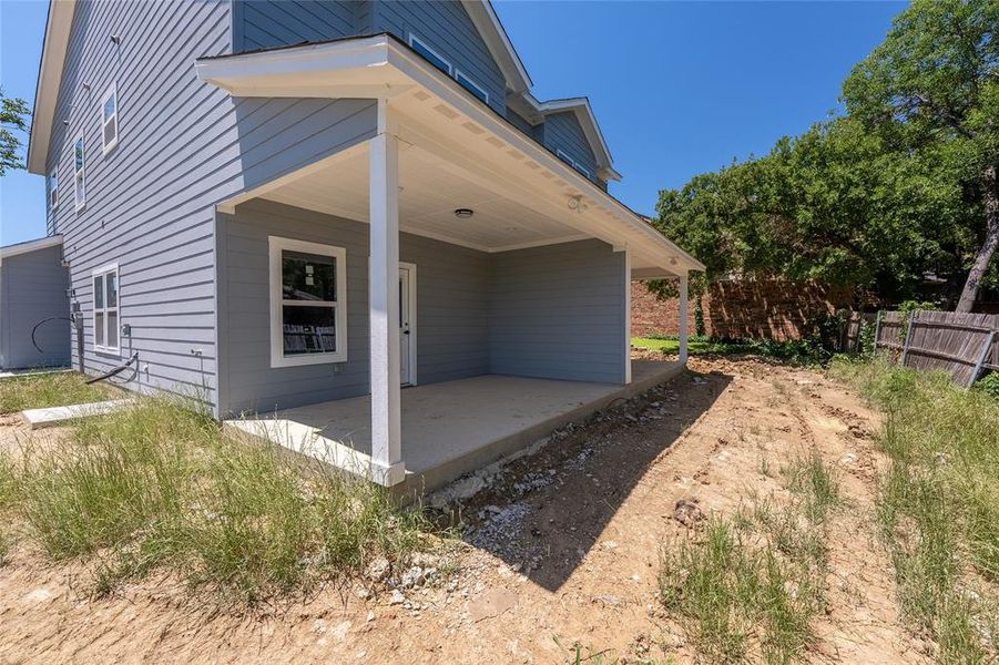 View of property exterior featuring a porch