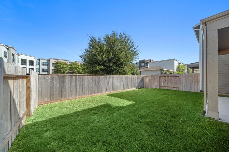 This surprisingly expansive backyard offers significantly more space than other properties in the subdivision, providing ample room for outdoor activities and gatherings.
