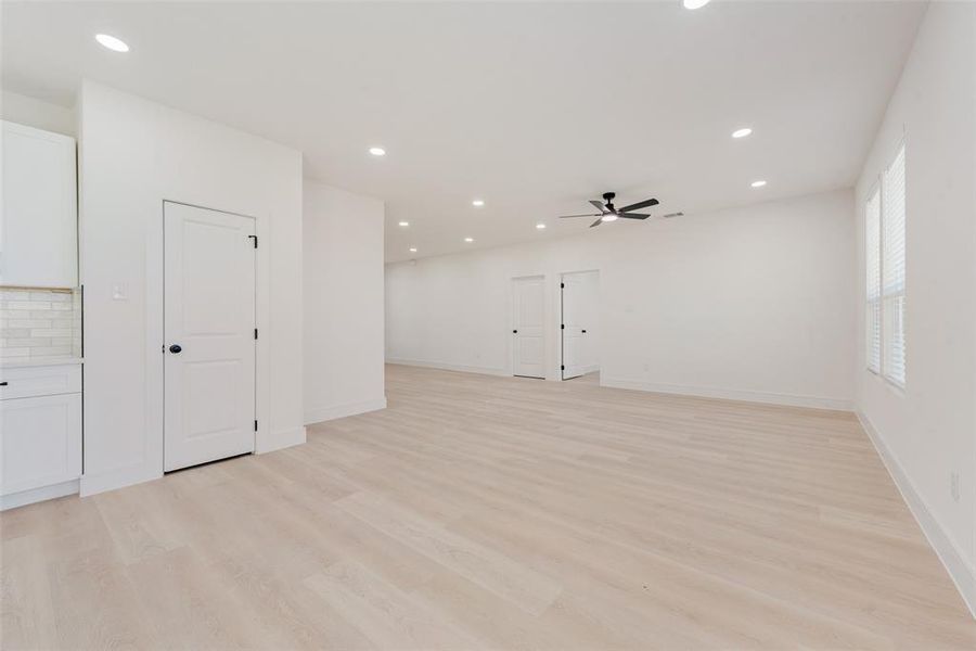 Unfurnished room featuring ceiling fan and light hardwood / wood-style floors