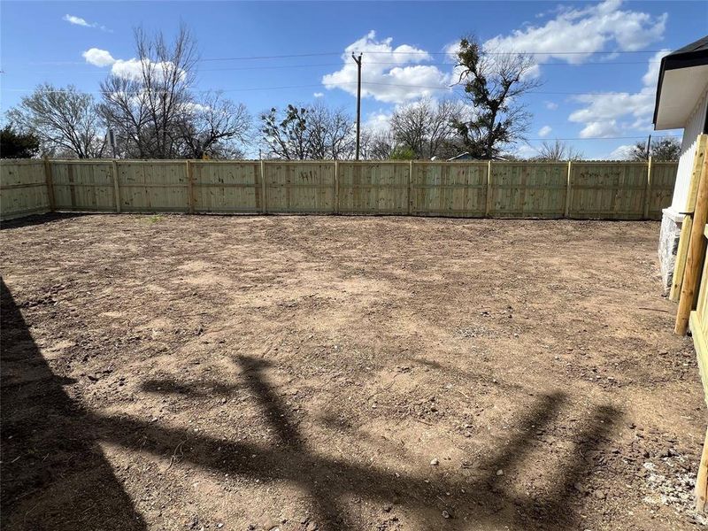 View of yard with fence