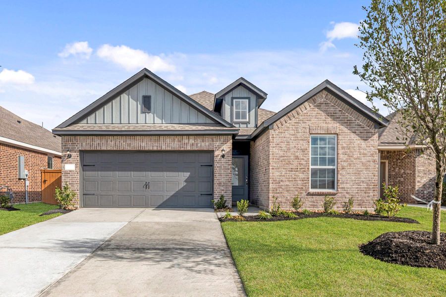 Front exterior of a new home in Emberly, Beasley, TX, highlighting curb appeal (Image 1).