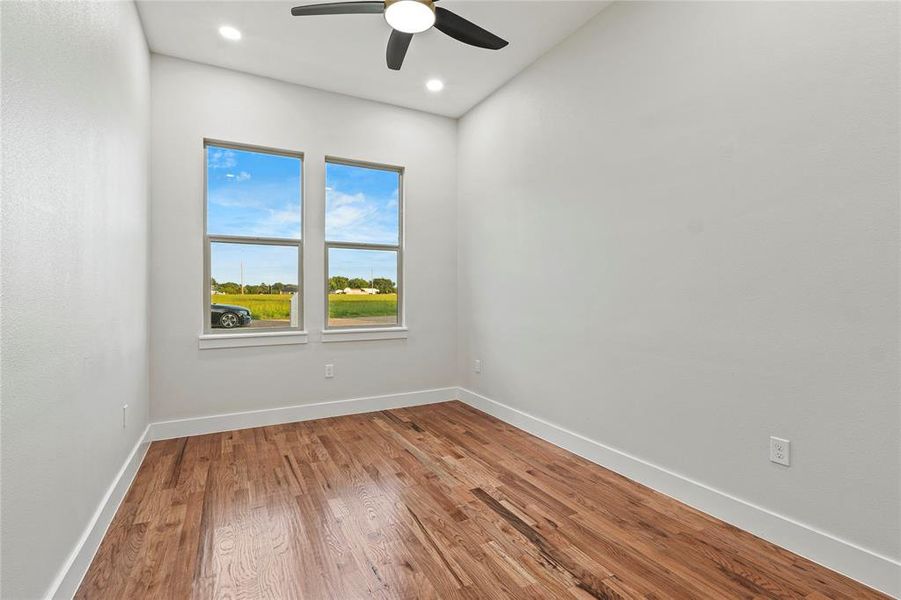 Spare room featuring ceiling fan, wood finished floors, and recessed lighting Spare room featuring ceiling fan, wood finished floors, and recessed lighting