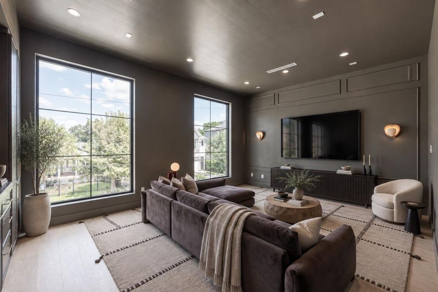 The dedicated media room sets a mood of its own, with darker finishes, generous proportions and large windows creating a comfortable retreat for movie nights and entertaining. The dedicated media room sets a mood of its own, with darker finishes, generous proportions and large windows creating a comfortable retreat for movie nights and entertaining.