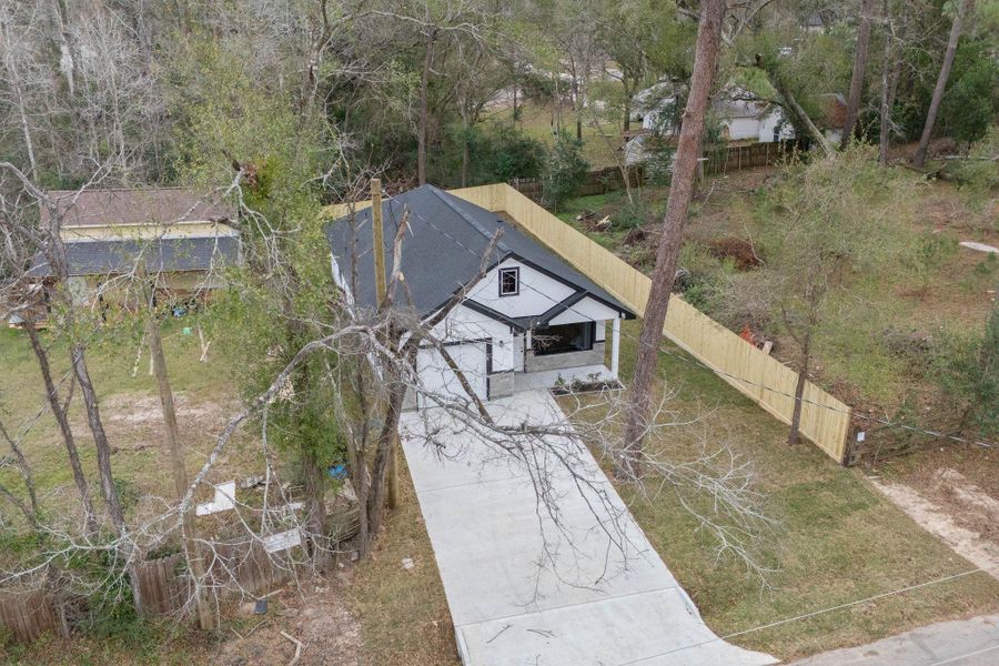 Front exterior of a new home in , Willis, TX, highlighting curb appeal (Image 23).