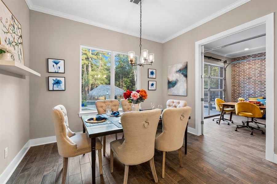 While having meals in this lovely dining room, you can enjoy views of the pool/outdoor retreat! The dining room can accommodate a larger table and more chairs if needed.  A large round table would provide ample room for larger crowds when dining.