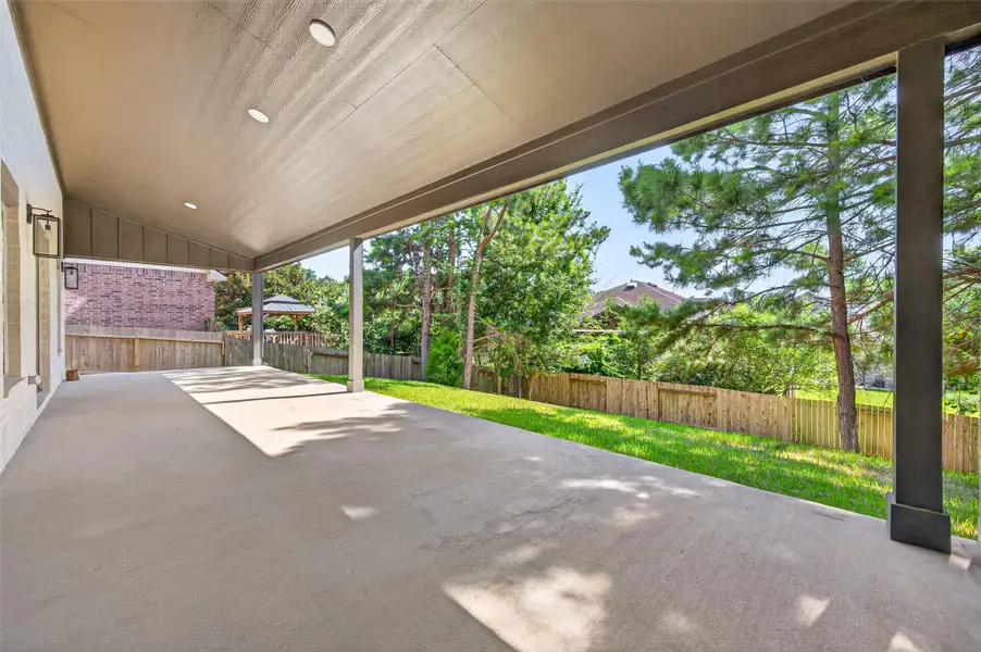 Exterior details and patio area of a home in , Conroe (Image 4).