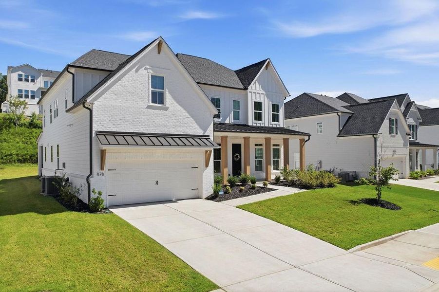 Front exterior of a new home in , Woodstock, GA, highlighting curb appeal (Image 27).