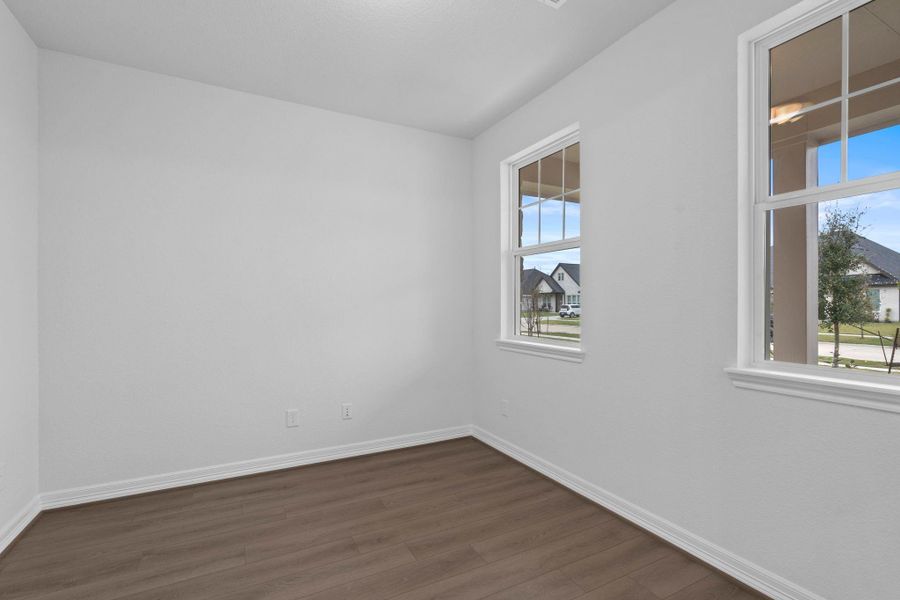 The home office features French doors, beautiful floors, large windows that give a fresh feel, this space promotes focus and creativity.