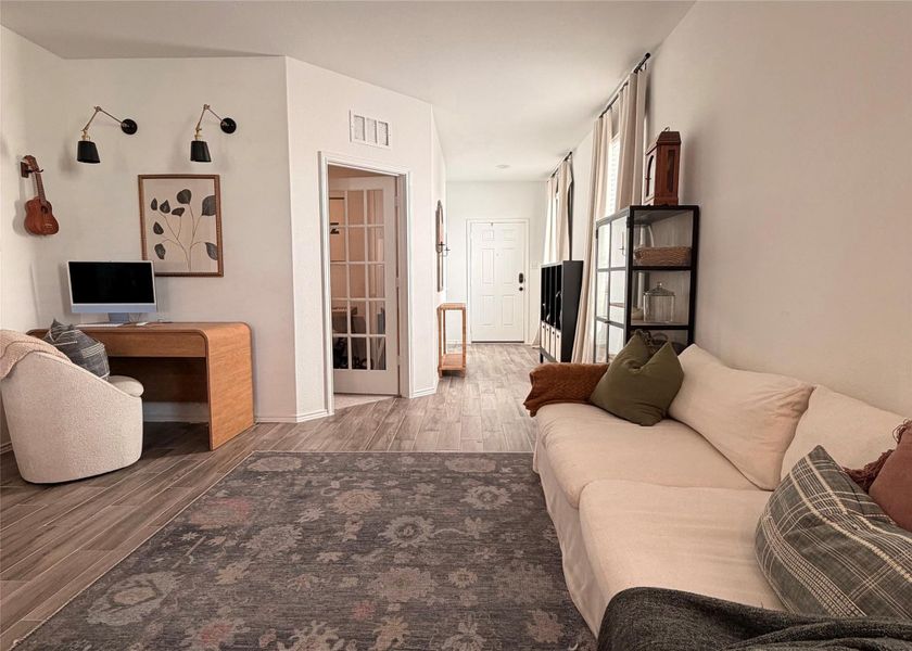 Living room featuring light wood finished floors Living room featuring light wood finished floors