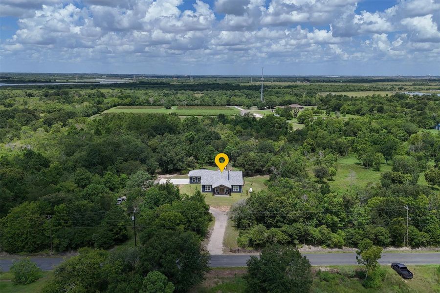 Overhead view of the front of the home. Property backs up to an orchard and Galveston Bay! Overhead view of the front of the home. Property backs up to an orchard and Galveston Bay!