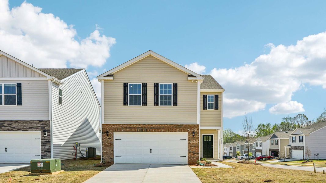 Front exterior of a new home in Huffman Ridge, Hickory, NC, highlighting curb appeal (Image 1). Front exterior of a new home in Huffman Ridge, Hickory, NC, highlighting curb appeal (Image 1).