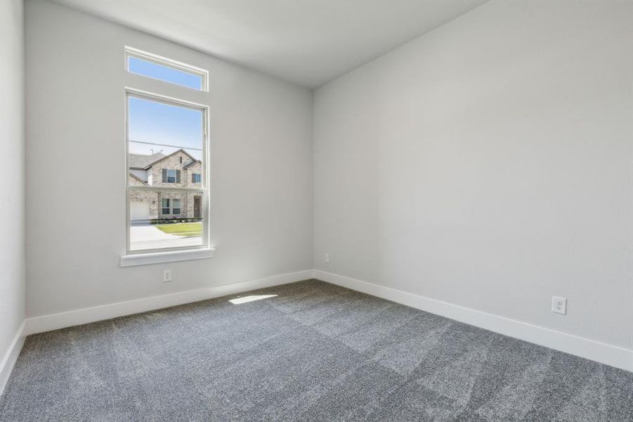 Spare room featuring carpet floors