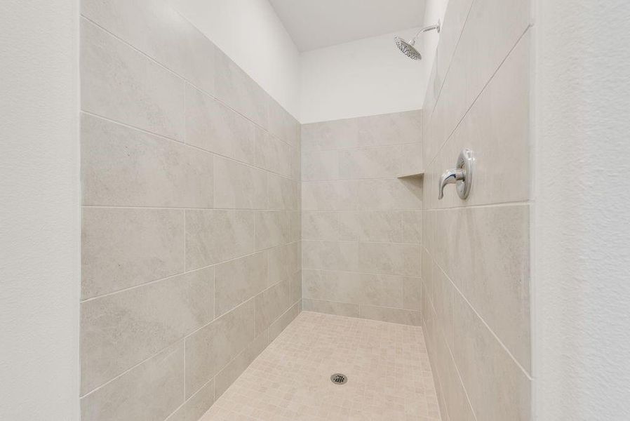 Full bathroom with tiled shower