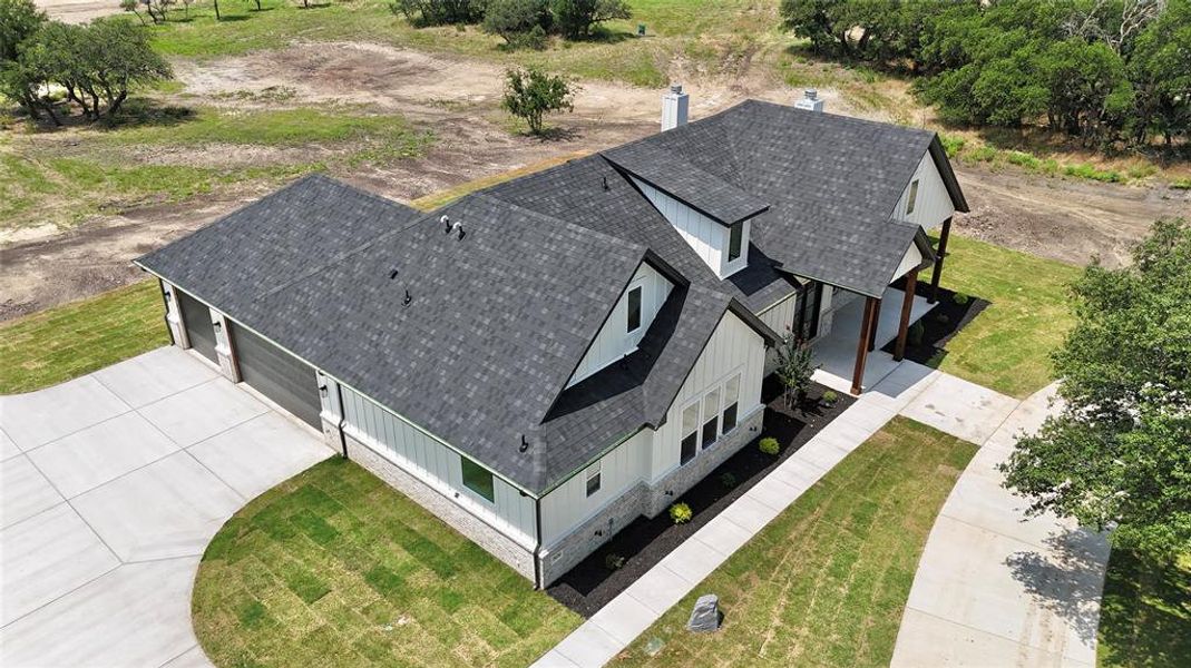 Front exterior of a new home in , Weatherford, TX, highlighting curb appeal (Image 32).