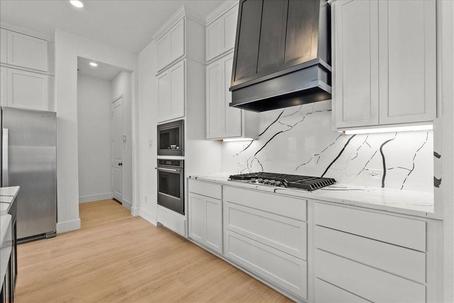 Double-stacked cabinetry, stainless steel appliances