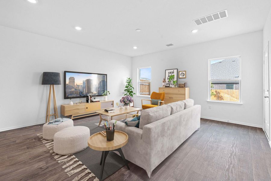 Living room with wood finished floors and recessed lighting Living room with wood finished floors and recessed lighting