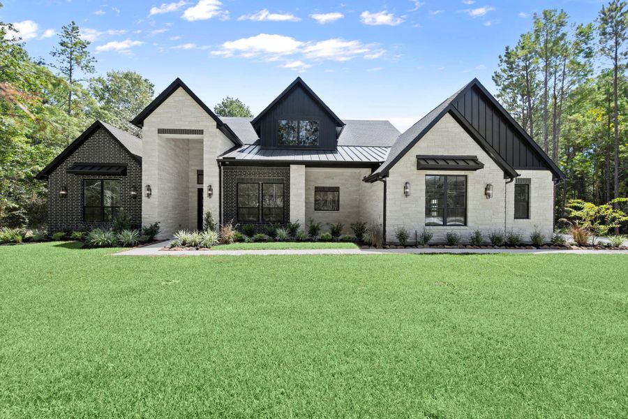 Front exterior of a new home in , Huntsville, TX, highlighting curb appeal (Image 22).