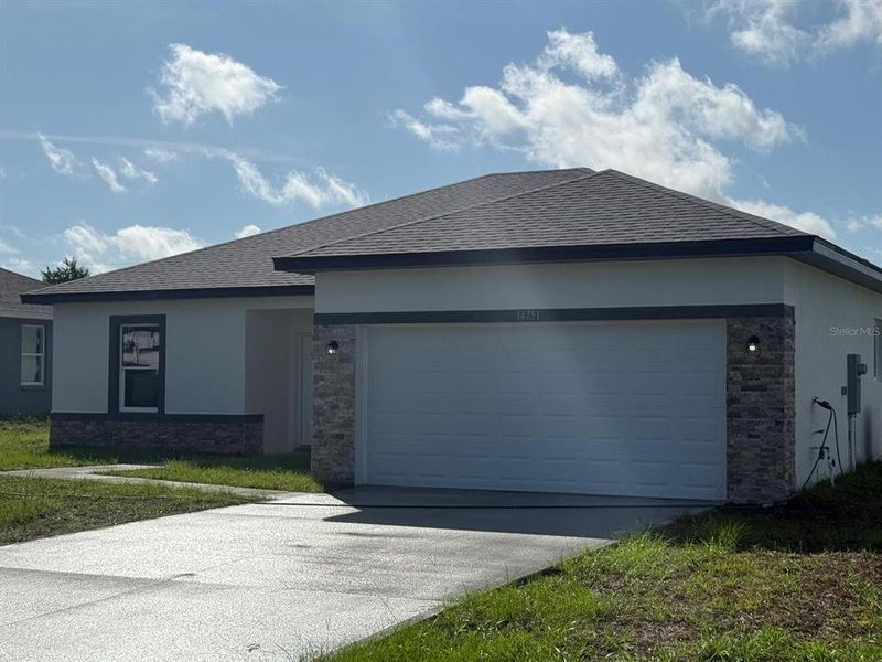Front exterior of a new home in , Ocala, FL, highlighting curb appeal (Image 18).