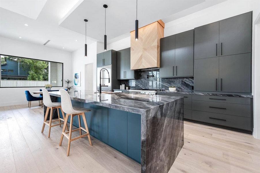 Luxury kitchen featuring top-of-the-line Thermador appliances, including a 6-burner range with griddle and a smart refrigerator equipped with built-in cameras for added convenience.