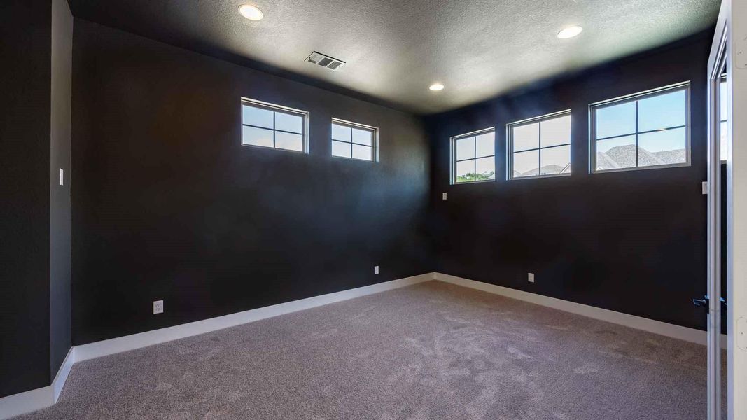 Unfurnished room with carpet, a textured ceiling, and recessed lighting Unfurnished room with carpet, a textured ceiling, and recessed lighting
