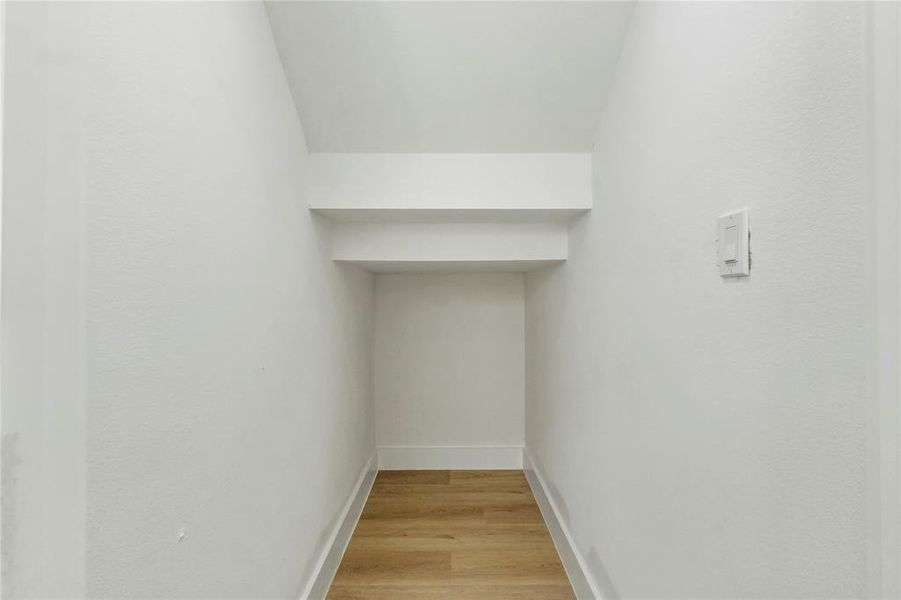 Detailed view of wood finished floors and baseboards