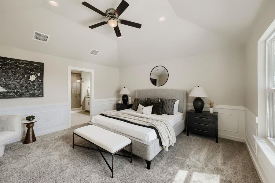 Relax in this tranquil bedroom, featuring a vaulted ceiling and direct bathroom access. Relax in this tranquil bedroom, featuring a vaulted ceiling and direct bathroom access.