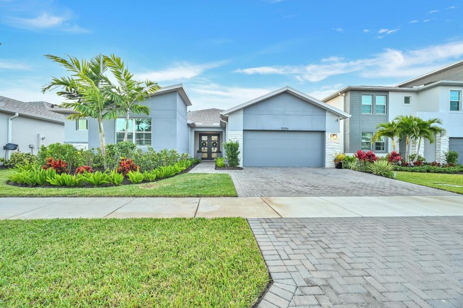 Front exterior of a new home in Tradition - Cadence, Port St. Lucie, FL, highlighting curb appeal (Image 2).