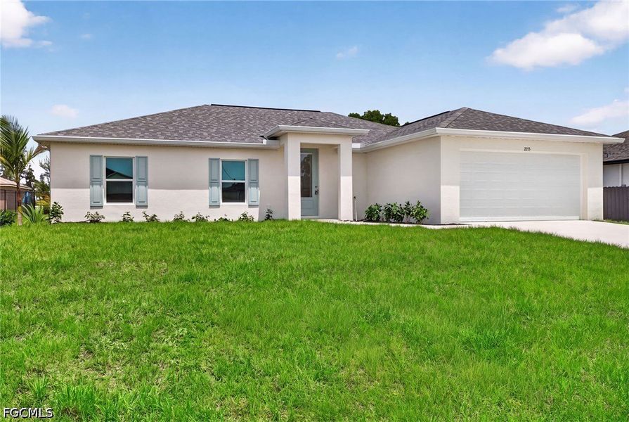Front exterior of a new home in Cape Coral, Cape Coral, FL, highlighting curb appeal (Image 2). Front exterior of a new home in Cape Coral, Cape Coral, FL, highlighting curb appeal (Image 2).