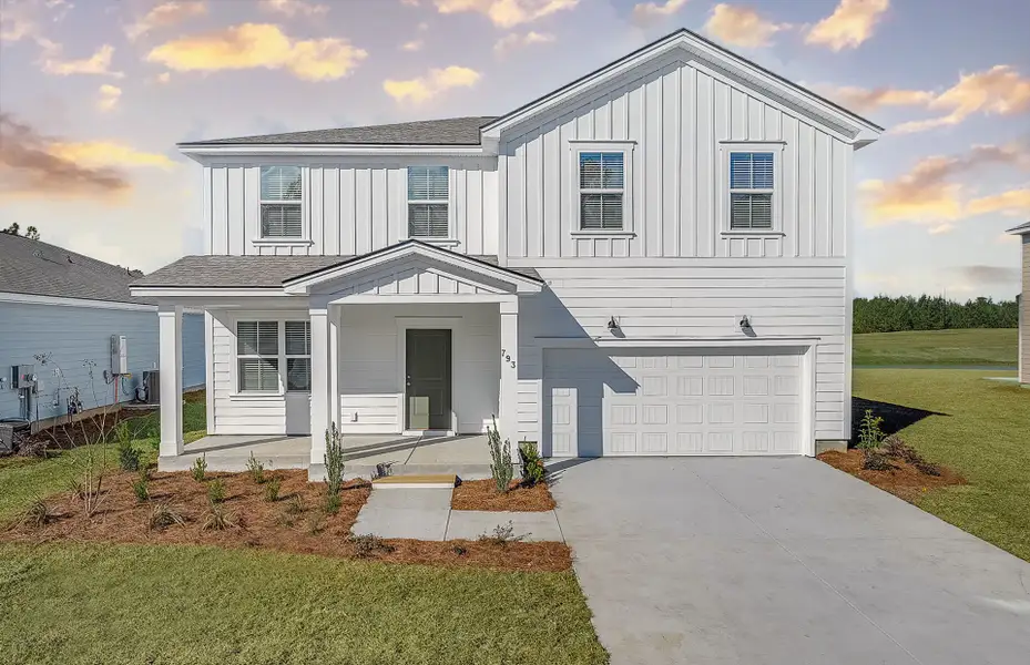 Front exterior of a new home in Heartwood, Richmond Hill, GA, highlighting curb appeal (Image 1). Front exterior of a new home in Heartwood, Richmond Hill, GA, highlighting curb appeal (Image 1).
