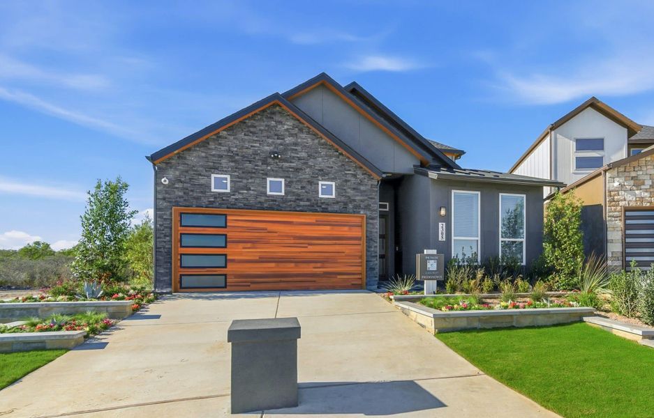 Front exterior of a new home in Prominence – Now Selling, San Antonio, TX, highlighting curb appeal (Image 23). Front exterior of a new home in Prominence – Now Selling, San Antonio, TX, highlighting curb appeal (Image 23).