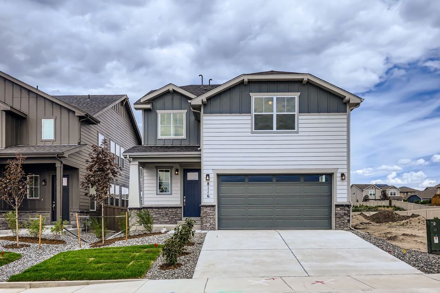 Front exterior of a new home in Sterling Ranch 40s, Colorado Springs, CO, highlighting curb appeal (Image 1).