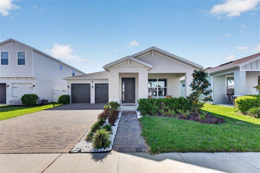 Front exterior of a new home in , Winter Garden, FL, highlighting curb appeal (Image 31).