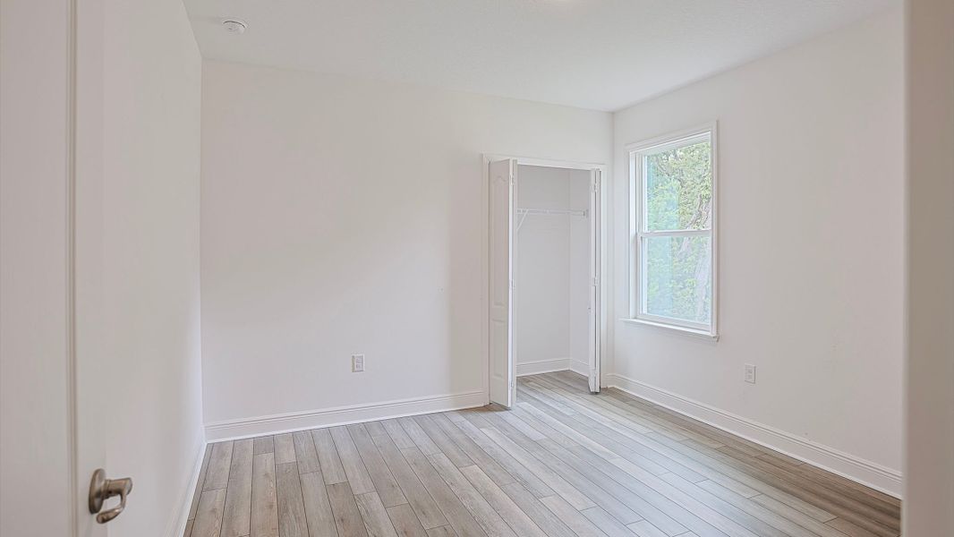 Spacious, unfurnished interior of a new home in Heritage Station, Punta Gorda (Image 12).