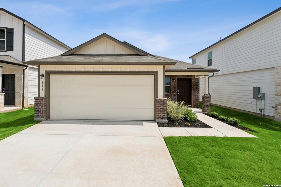 Front exterior of a new home in Winding Brook, San Antonio, TX, highlighting curb appeal (Image 17).