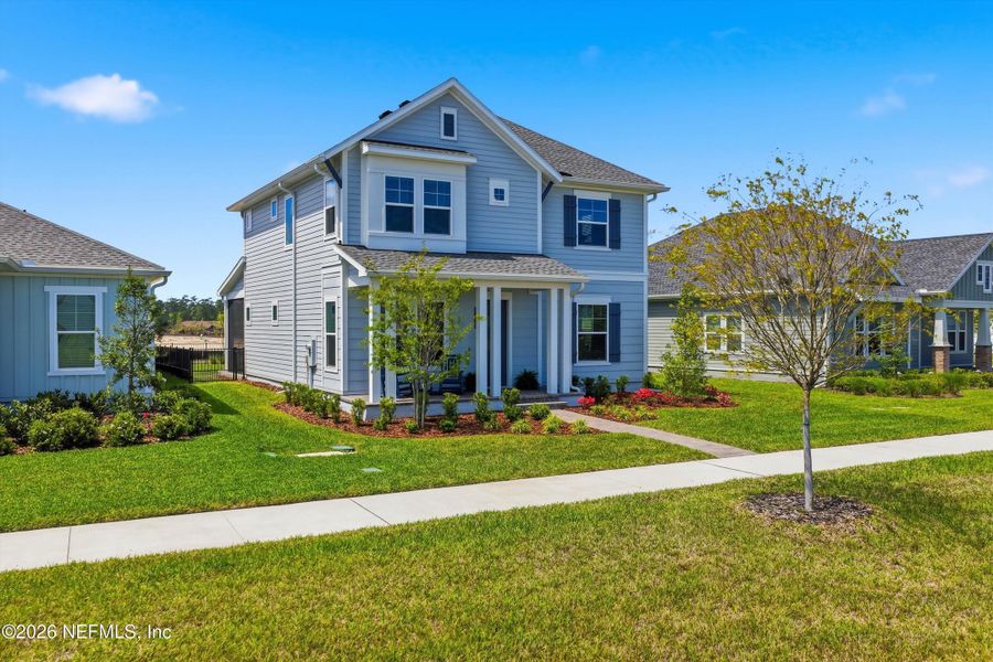 Front exterior of a new home in Seven Pines 50' Rear Entry, Jacksonville, FL, highlighting curb appeal (Image 25).