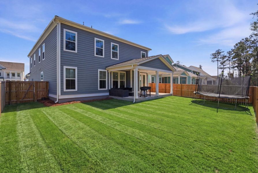 Exterior details and patio area of a home in Tidewater at Lakes of Cane Bay, Summerville (Image 28).