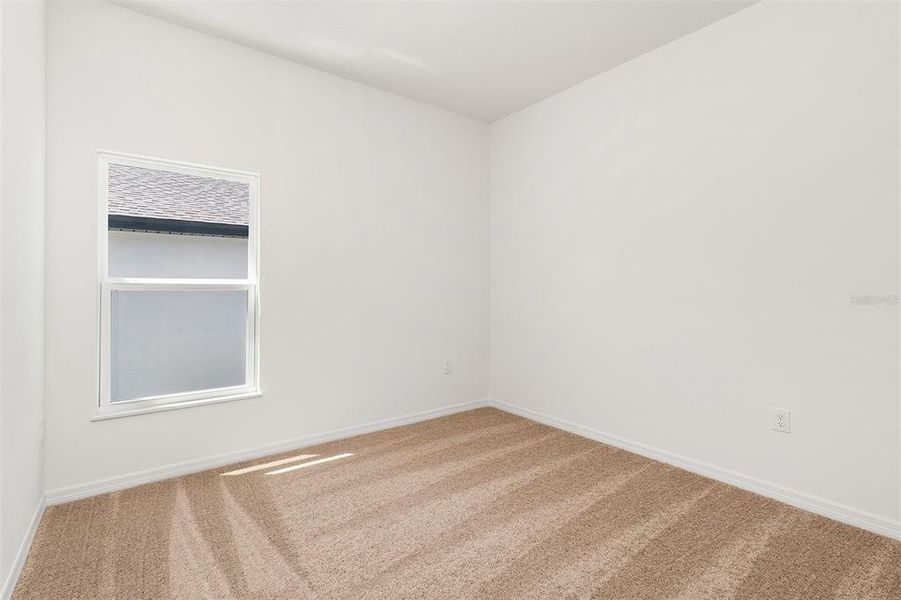 Spacious, unfurnished interior of a new home in Peach Crossings, Winter Haven (Image 15).