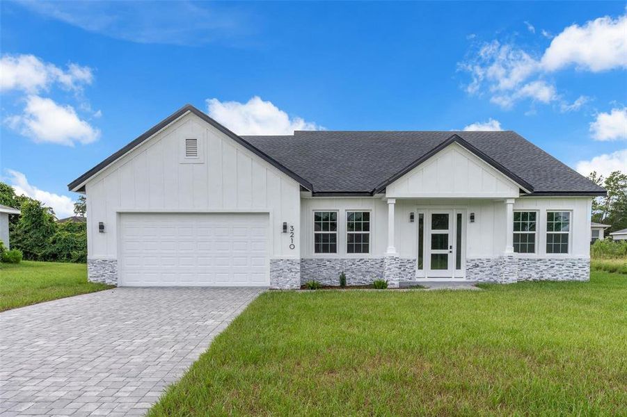 Front exterior of a new home in , Ocala, FL, highlighting curb appeal (Image 21).