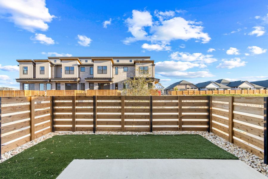Exterior details and patio area of a home in Willow Grove Townhomes, Melissa (Image 25).