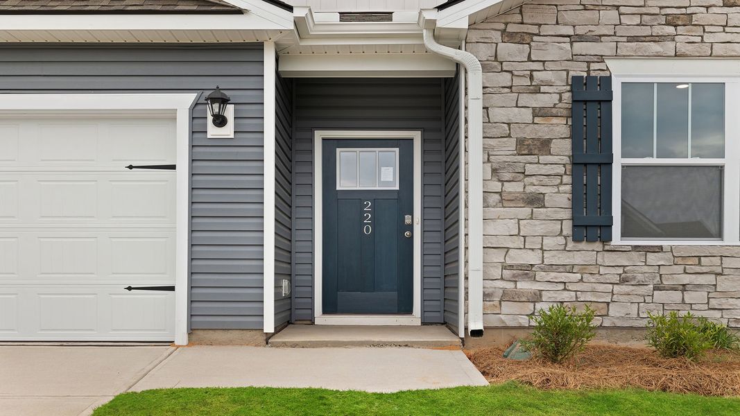 Exterior details and patio area of a home in Durbin Meadows Traditions, Fountain Inn (Image 2).