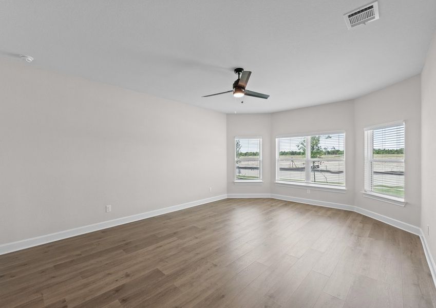 The master bedroom of the Cypress plan has three large windows that let in great, natural light.