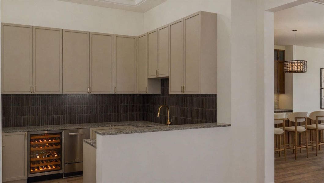 The wet bar doubles as a wine grotto off the dining room. The wet bar doubles as a wine grotto off the dining room.